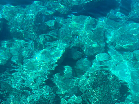 Mediterranean sea crystal clear blue water with rocky seabed