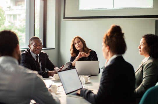 Diverse business team meeting in modern conference room