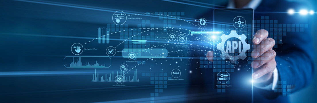 Software developer working on mobile API (Integration) frameworks. Programmer using a tablet analyzing digital endpoints and seamless system connectivity charts on a holographic interface.