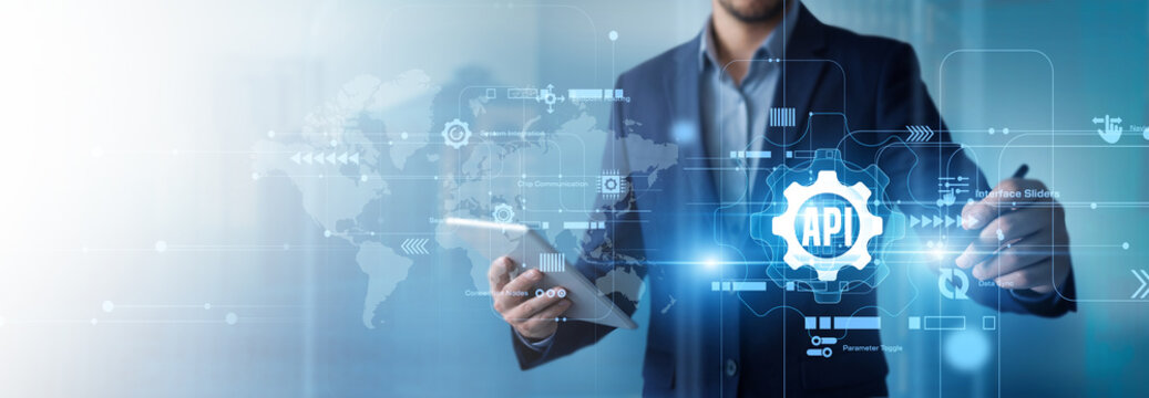 Software developer points at an API (Integration) interface, linking applications through a connected network while viewing requests, data exchange, and system performance. Digital concept.
