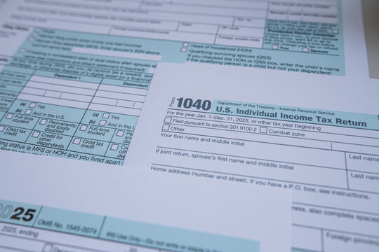 Close up Background of Official US IRS Form 1040 Tax Papers for Financial Analysis and Planning