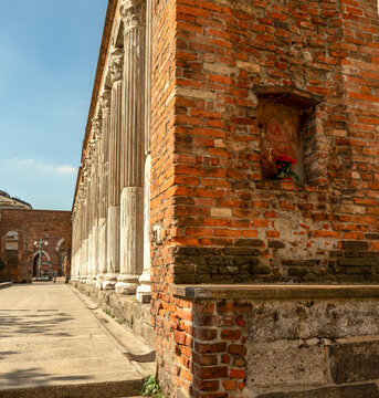  The Columns of San Lorenzo in Milan, an ancient Roman colonnade dating from the 2nd or 3rd century AD, with a small votive niche set into the side wall made of red bricks