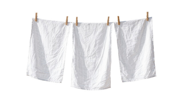 Three white linen towels drying on a clothesline with wooden pegs, isolated on transparent background