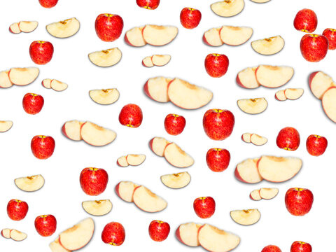 Vibrant red whole apples and fresh apple slices arranged in a repeating pattern against a clean white background. Top view flat lay of fresh ripe red apple fruit, healthy food design element.