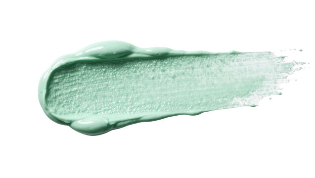 Green cosmetic cream smear with subtle shimmer, isolated on transparent background