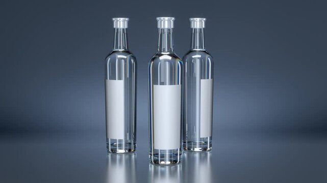 Rotating realistic clear glass liquor bottles with blank labels on a gray background. 3d animation
