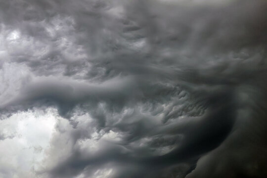 Dark thunderclouds over the harbor and coast of Rotterdam&rsquo;s Maasvlakte