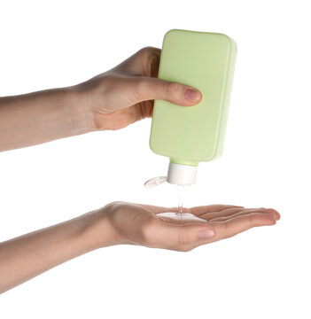 Woman squeezing shampoo from bottle into hand on white background, closeup