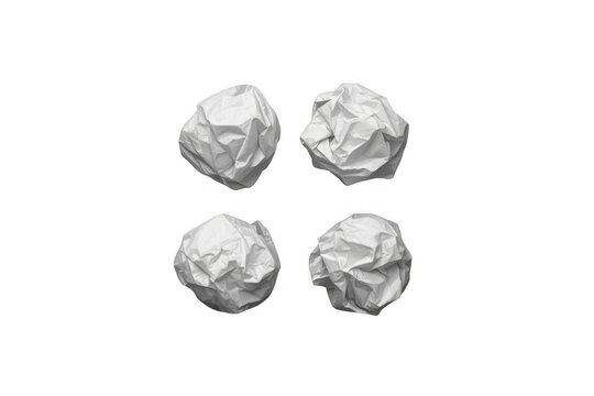 Four crumpled white paper balls