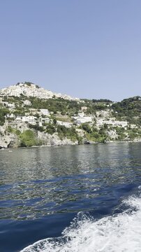 Scenic Hillside Coastal Village Above Calm Blue Sea in 4K