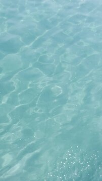 Crystal Clear Turquoise Sea Water with Natural Sunlight Reflections in 4K