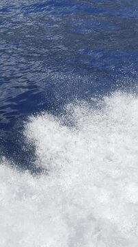 Powerful White Boat Wake and Sea Spray on Deep Blue Water in 4K
