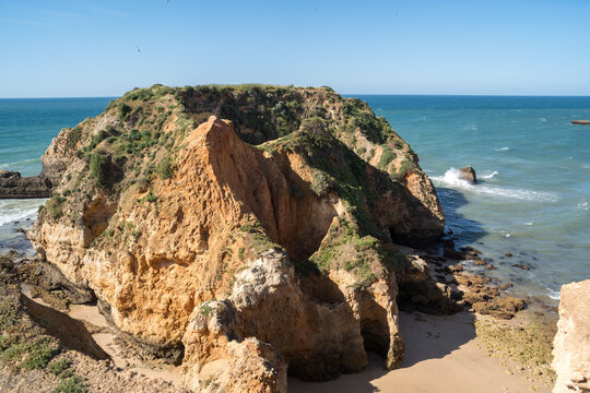 Coastal cliffs and ocean waves near Portimo Portugal