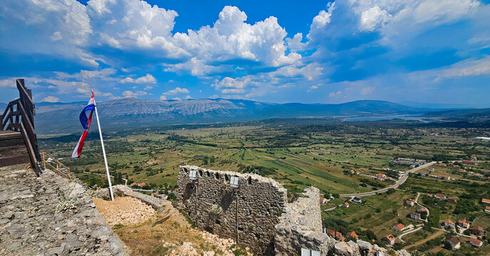 Wonderful photos of a stunning landscape in Croatia, featuring sweeping views, arid terrain, and endless expanses with water and buildings