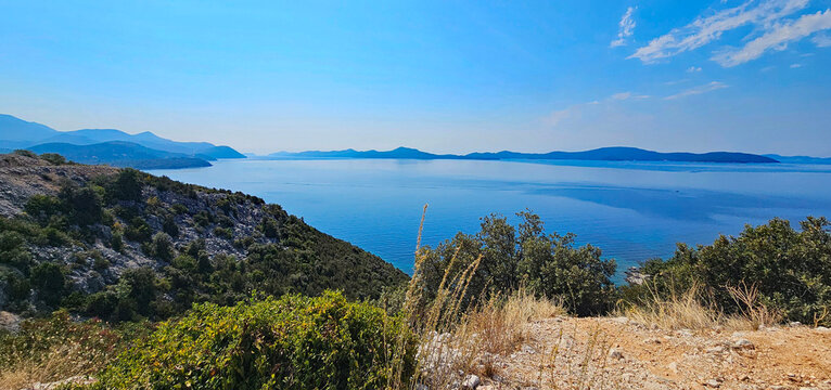 Wonderful photos of a stunning landscape in Croatia, featuring sweeping views, arid terrain, and endless expanses with water and buildings