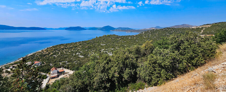 Wonderful photos of a stunning landscape in Croatia, featuring sweeping views, arid terrain, and endless expanses with water and buildings