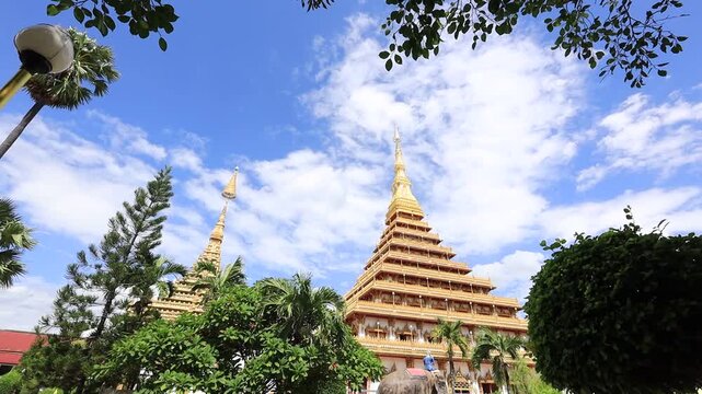 Scenic video views of sculptures set against beautiful skies at Wat Phra That Nong Waeg and Wat Thung Setthi in Khon Kaen, Thailand.