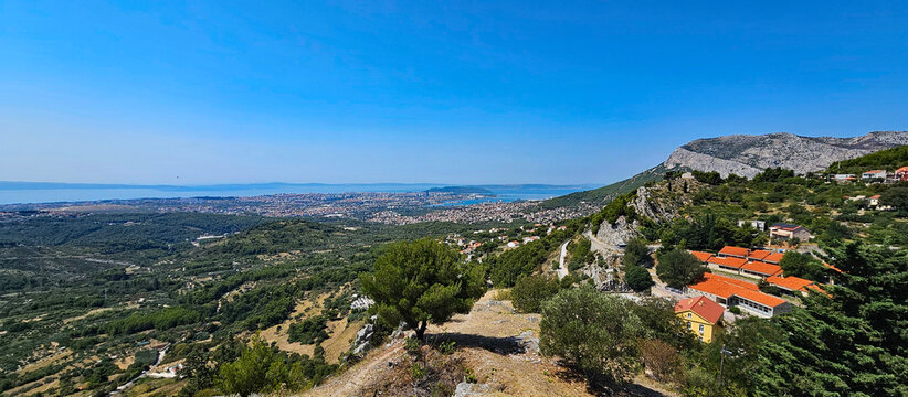 Wonderful photos of a stunning landscape in Croatia, featuring sweeping views, arid terrain, and endless expanses with water and buildings