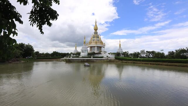Scenic video views of sculptures set against beautiful skies at Wat Phra That Nong Waeg and Wat Thung Setthi in Khon Kaen, Thailand.
