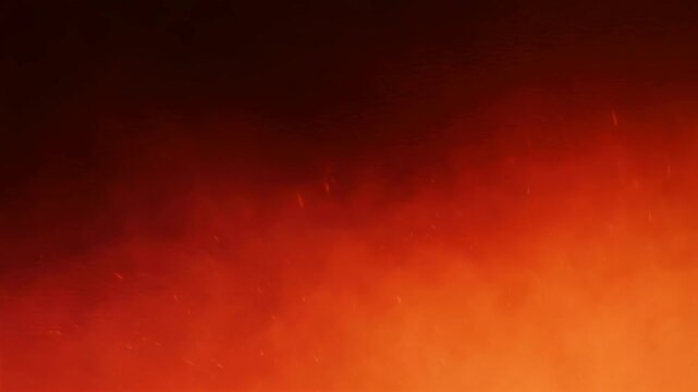 Abstract orange smoke clouds moving on dark background. Fiery fog texture with warm glow. Autumn atmospheric backdrop for design and halloween concept