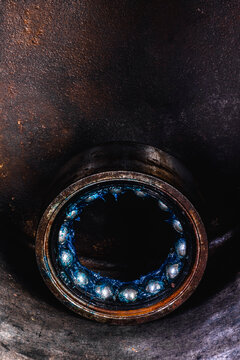 Old industrial ball bearing with grease, raceways and rolling elements, mechanical component, support loads and reduce friction