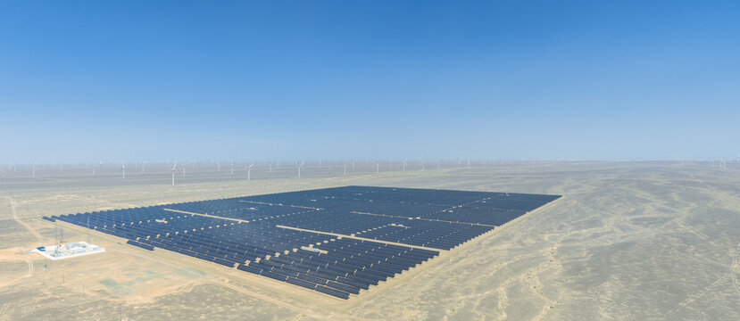 High-Angle Side View of Solar Array, Substation and Wind Farm in Gobi Desert