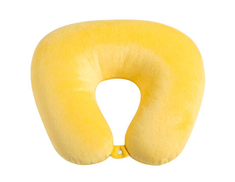 A soft yellow neck pillow with a curved ergonomic U-shape design, featuring plush padded filling and smooth fabric, captured in a studio shot and isolated on a transparent background for use.