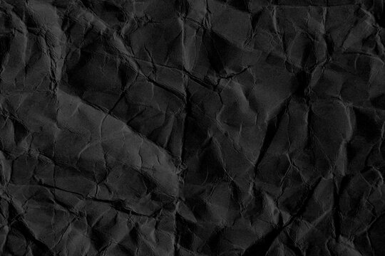  Fondo detallado con textura de papel negro arrugado. Fondo con superficie de papel oscuro arrugado; transmite minimalismo, elegancia y dise&ntilde;o t&aacute;ctil.