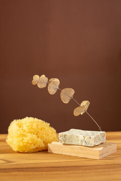 Natural herbal soap with scrub. Handmade soap bars on a wooden background. Space for text. 