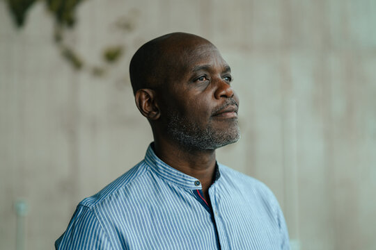 Mature african american man thinking and looking up