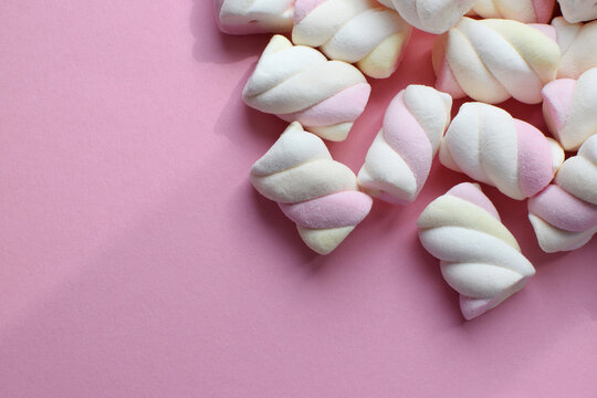 Multi-colored marshmallows. Background or texture of colorful blue and pink marshmallows.