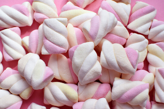 Multi-colored marshmallows. Background or texture of colorful blue and pink marshmallows.