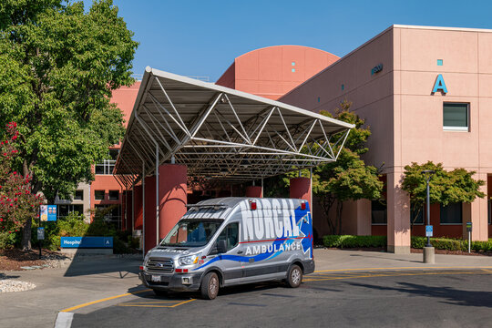 Kaiser Permanente Roseville Medical Center entrance with NorCal Ambulance vehicle parked, representing healthcare emergency services in California, August 2026