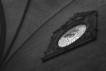 an old clock located in the historic Palazzo della Mercanzia in Bologna © claudio