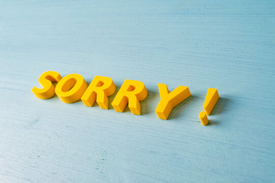 Apology, regret and making amends concept with yellow SORRY message