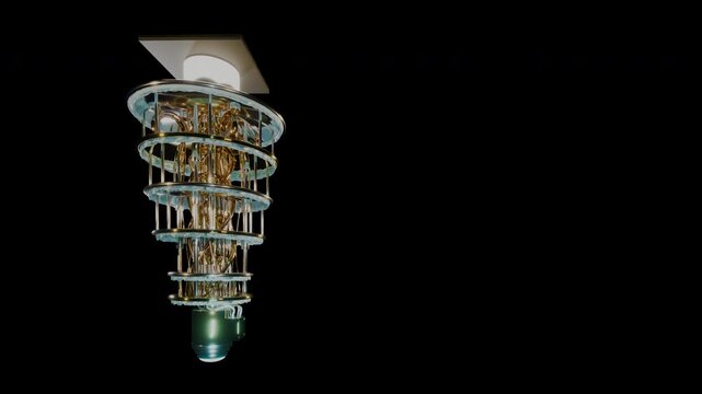 Dramatic nadir perspective looking straight up into suspended quantum chandelier.