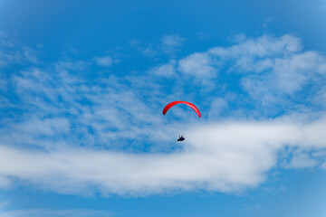 Paragliding sport activity. Parachute in the sky. Extreme rest and paragliding. Summer vacation. Extreme sport. Parachute paraglide. Sport and activity lifestyle. Paraglider paragliding recreation © be free