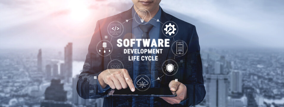 Professional Businessman in Suit Displaying Software Development Life Cycle Concept on Tablet with Cityscape in Background Quark.
