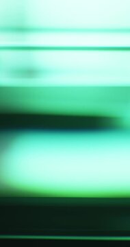 Rainbow of ethereal lights illuminate the brilliance of a smooth reflective glass prism. Colorful light refraction creating an aura of vivid saturated colors for a dreamy abstract background. Loop.