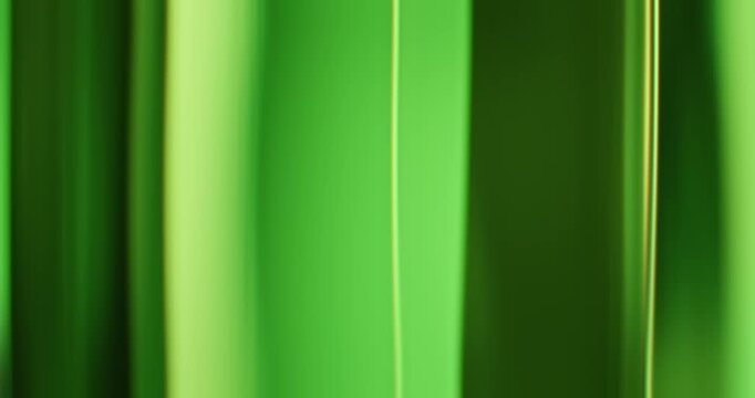 Rainbow of ethereal lights illuminate the brilliance of a smooth reflective glass prism. Colorful light refraction creating an aura of vivid saturated colors for a dreamy abstract background. Loop.
