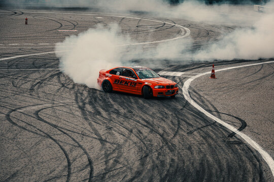Drifting action at motorsport event in Lviv, Ukraine with smoke and speed