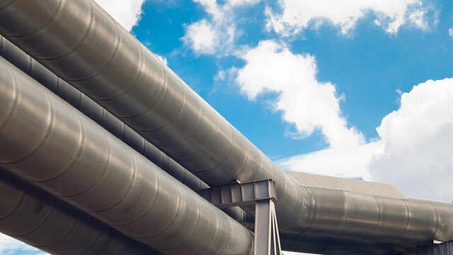 close-up of a pipeline against a blue sky