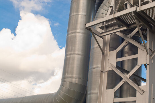 close-up of a pipeline against a blue sky