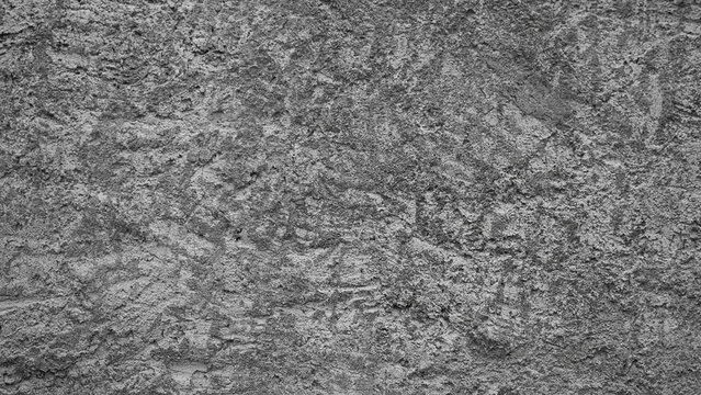 Gray background, photo of the texture of an old wall with various lines, embossing, and brushstrokes