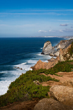 Waves crashing on Cabo da Roca cliffs landscape Portugal