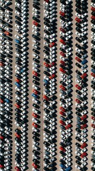Obraz premium Aerial view of vast car parking lot with neatly arranged rows of vehicles. Many cars parked close together, creating dense pattern on asphalt surface. Scene highlights urban transportation, storage