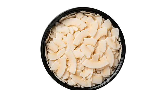 Shredded coconut flakes filling a black bowl presented on transparent background desiccated copra kernel meat food ingredient tropical