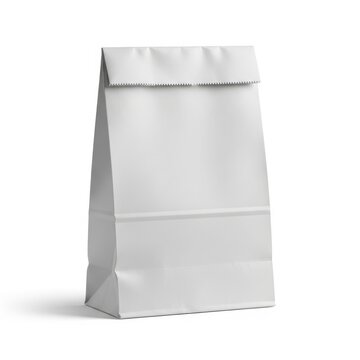 A plain white paper lunch bag standing upright against a plain background