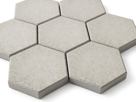 Grey hexagonal concrete pavers arranged in a honeycomb pattern. These paving stones offer a modern, clean look for outdoor spaces like patios or walkways.