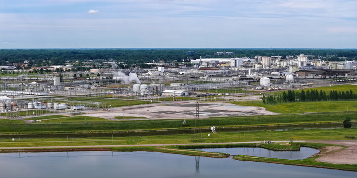Industrial chemical plant complex producing chemicals and resins.